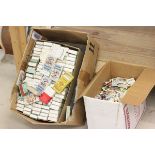 Two cartons of cigarette cards in packets plus a large quantity of loose including Lyons, Wills,
