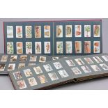 Three albums of cigarette cards