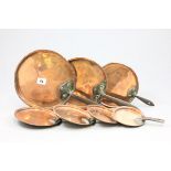 Seven Antique Copper Pan Lids with Iron Handles