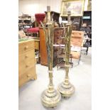 Pair of 19th century Brass Ecclesiastical Tall Candle Stands, each column formed with three stylised