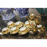 Gold Coloured Coffee Set with Figural Panels including Coffee Pot, Cream, Sugar, Six Cups and