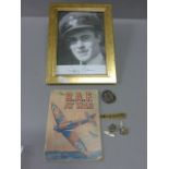 Signed Photograph of RAF Pilot, The R.A.F at War Booklet, Royal Signals Cap Badge, another Cap Badge