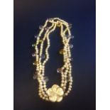 Triple String Pearls interspersed with collunder crystals Necklace with mother of pearl clasp