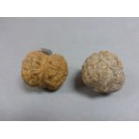 Pair of Walnut Kernels, the outside carved to depict the original followers of Buddha 'The 18