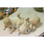 Two 19th century Continental Bisque Piano Babies (one a/f)
