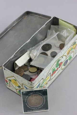 Tin of mixed UK and world coins