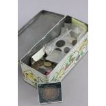 Tin of mixed UK and world coins