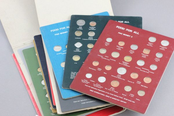 Set of 8 Food For All Money coin sets number 1-8 plus paperwork