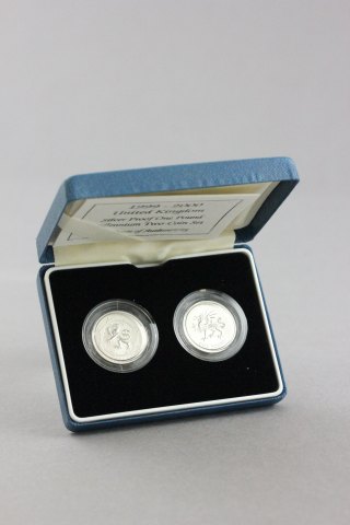 Two cased silver proof £1 coins