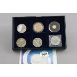 Eight Collectable UK coins including silver £2 and £5 coins