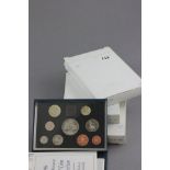 Three boxed proof year coin sets