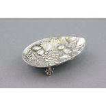 Silver Spoon Rest with embossed fruit and floral decoration on three shell feet, 800 grade