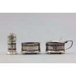 Silver Three Piece Cruet Set comprising Salt Cellar, Mustard Pot and Pepperette, all with blue glass