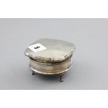 Silver Circular Trinket Box, the hinged square lid with engine turning raised on three pad feet,