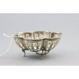 Small Silver Scalloped Shaped Bowl with pierced edge raised on three pad feet, hallmarks rubbed