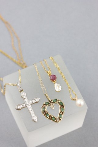Four 9ct Gold Chains with Pendants (Cross, Heart, Pearl and a Red & Clear Stone)