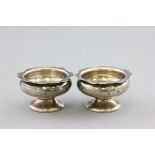 Pair of Silver Circular Salts, each on pedestal foot, London 1906