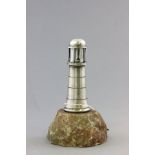 Novelty Table Lighter in the form of a Silver Plated Lighthouse mounted on a Stone Base