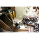 Two Oak Cased Sewing Machines