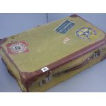 Vintage Leather Bound Canvas Suitcase with Various Luggage Labels