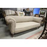 Victorian Chesterfield Sofa upholstered in Herringbone Tweed raised on four turned feet and castors