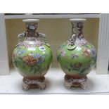 Pair of Oriental Green Ground Vases with Elephant Mask Handles