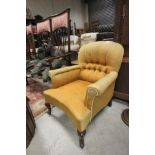 Victorian Buttonback Yellow Upholstered Armchair on scroll carved legs