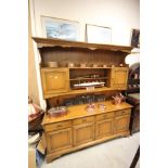 Pale Oak Effect Stag Dresser with shelves over four drawers and four cupboards