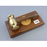 Wooden and Brass Gavel on Wooden Block