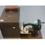 Early 20th century Wooden Cased Wilcox & Gibbs Sewing Machine with Wilcox & Gibbs Tin containing