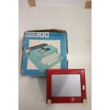 Boxed Marx 300 typewriter and an original Magic Etch a Sketch