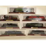 Seven Collectable Model Locomotive models on stands in original packaging