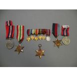 Five World War II Medals including 2 x 1939-45 Star, Italy Star plus a Bar of Replica Miniature