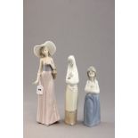 Three Nao Figures - Girl with Hat and Basket, Nun with Rabbit and Girl in Blue and White Dress