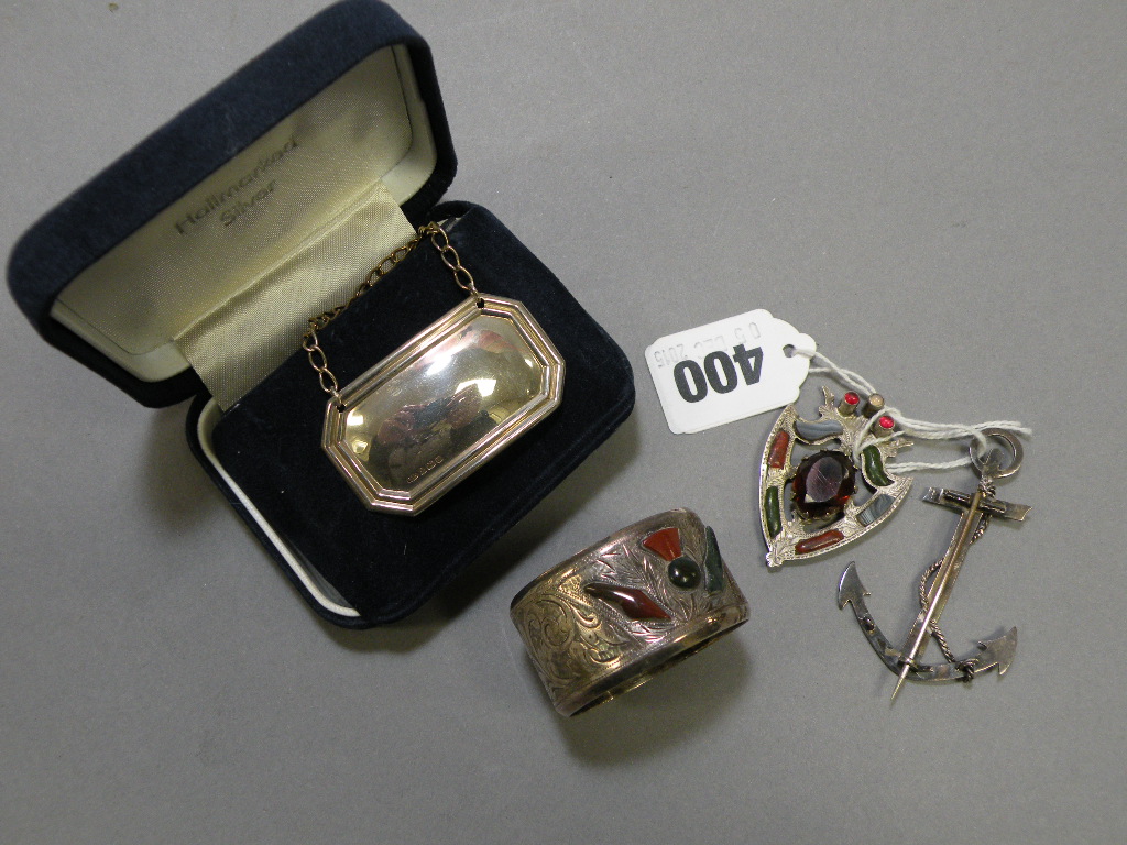 Silver Brooch (clasp missing) and a Silver Napkin Ring, both inset in a Scottish form with agates