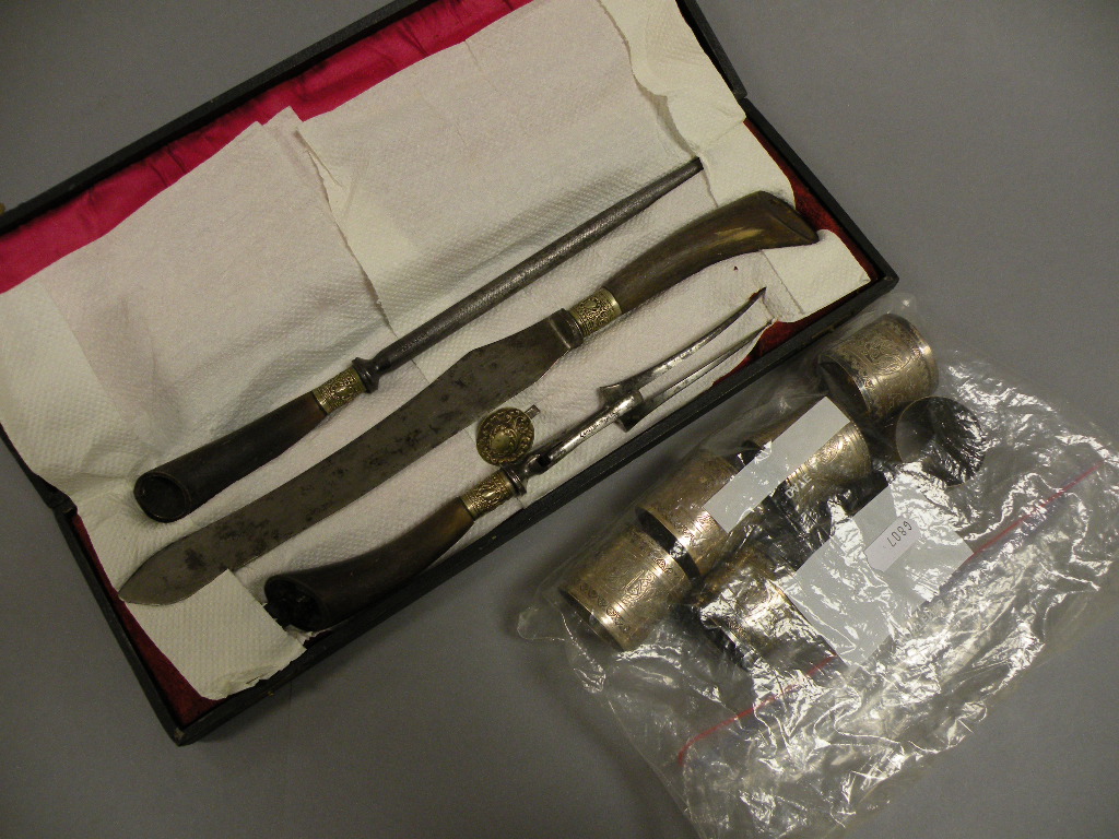 Cased Three Piece Horn Handled Carving Set and Six Silver Plated Napkin Rings and a Salt Pot