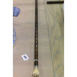 Slim Cane with Carved Ivory Hand holding a Baton and with Silver Band (rubbed)