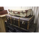 Three Vintage Suitcases and a Trunk