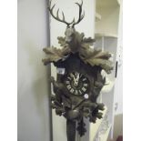 Early 20th century Black Forrest Cuckoo Clock, the clock decorated with carved animals and Stag,