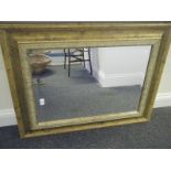 Gilt framed overmantle mirror with beveled edged mirror, 24" x 30" approx in an antique style frame