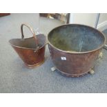 Large brass and copper log basket on Lion paw feet with Lion head handles, and a similar period