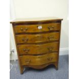 Serpentine fronted chest of small proportions containing 4 graduating drawers on a shaped apron