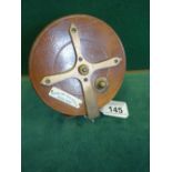News of the World .wooden fishing reel in mint condition, brass highlights