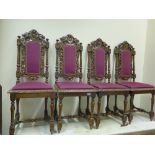Matching set of 4 19 th century Jacobean style carved chairs with Black forest style decoration to