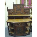 Delicate Arts & Crafts period profusely carved Chiffonier with a carved decorative back and 2 panels