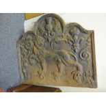 Decorative antique style cast iron fire back with picture decoration to the front,