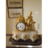 19c Alabaster and gilt decorated mantle clock with an 8 day timepiece striking on a bell, seated