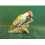 Rosenthal, a well crafted figurine of a Woodpecker on a tree stump, 11" long 6" tall, signed