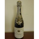 Half bottle of 1945 Vintage Champagne by Louis Dornier, very low on shoulder capsule and cork in