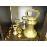 Collection of brass weights including a 28lb one, graduating weights, all Bell shaped 11 items,